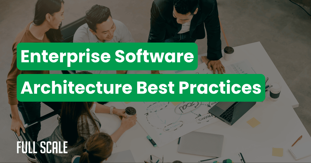 Four people collaborate around a desk filled with papers, laptops, and coffee cups, discussing scalable enterprise software architecture. The text "Enterprise Software Architecture Best Practices" is overlaid.