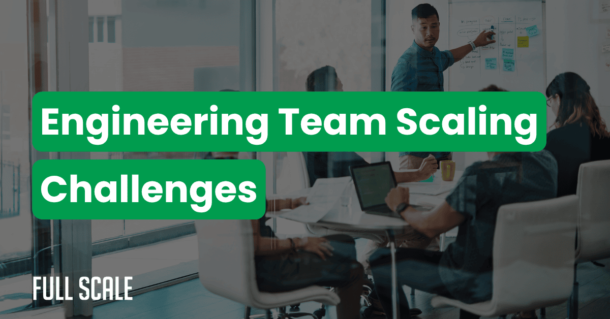 A man points to a whiteboard during a meeting with four colleagues in a modern office. The text reads "Engineering Team Scaling Challenges: 50 Person Engineering Team Structure.