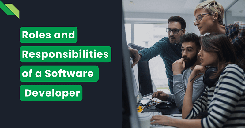Team of software developers discussing roles and responsibilities at a computer.