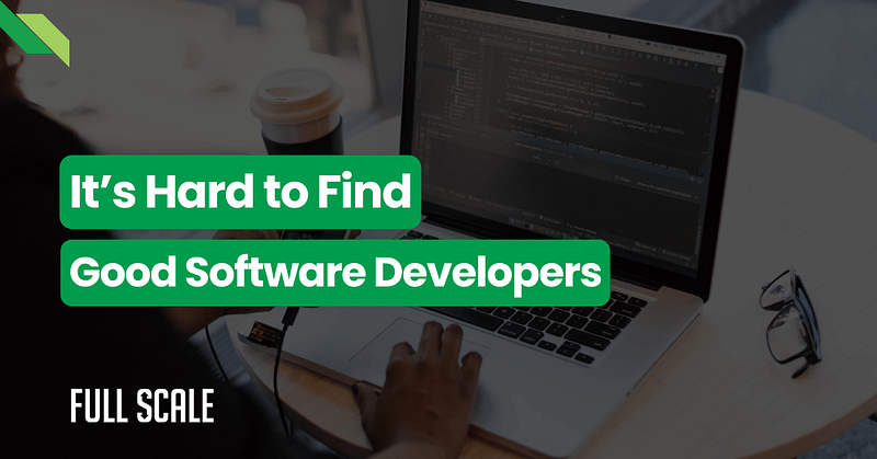 Person working on software development next to a coffee cup with text overlay about how difficult it is to find good software developers.