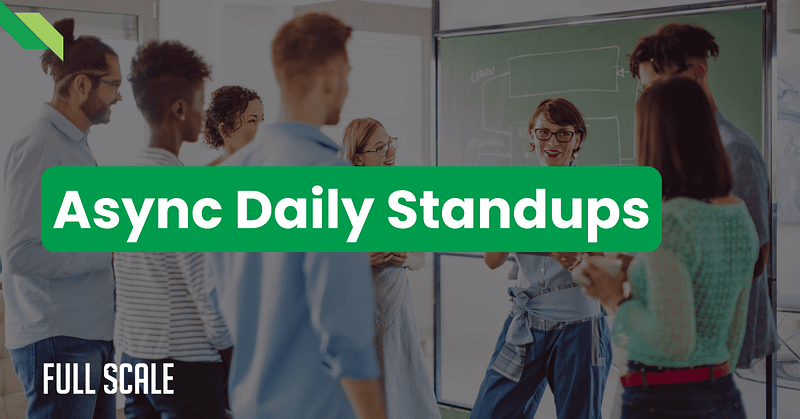 Group of people standing and discussing in a room, with the text "Async Daily Standups" overlaid.