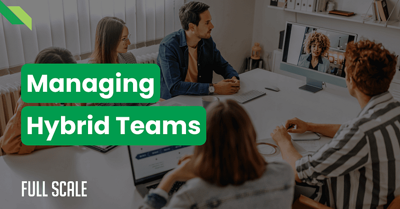 In a meeting room, people engage in a video conference, exemplifying remote and local team collaboration. Text on the image reads, "Managing Hybrid Teams" and "Full Scale.