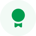 Green circle featuring a white ribbon icon in the center.