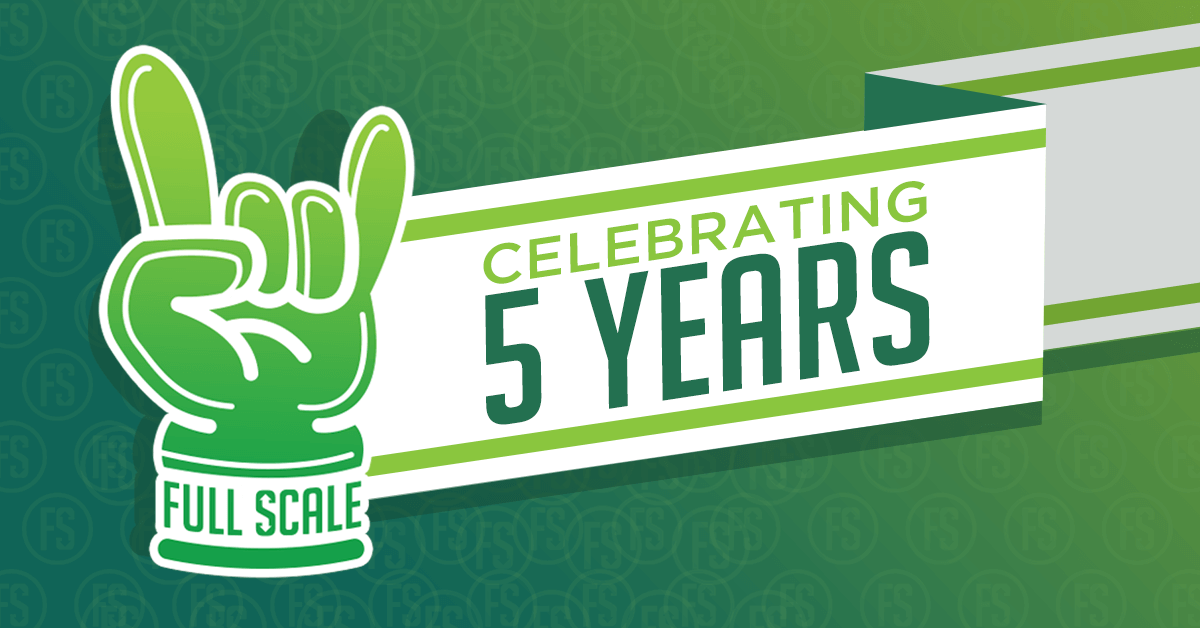 Graphic banner featuring a green hand making a peace sign with the text "full scale, celebrating 5 years" on a full-scale geometric background.