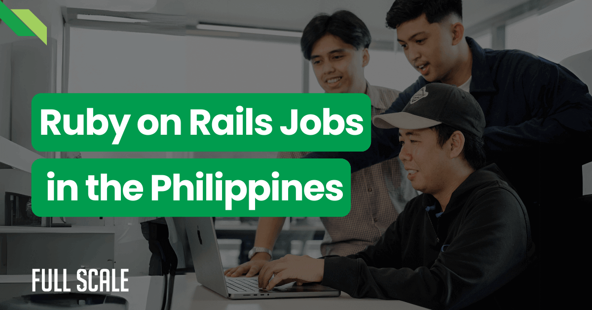 Three smiling men collaborating at a computer in an office setting with text overlay "ruby on rails jobs in the philippines.