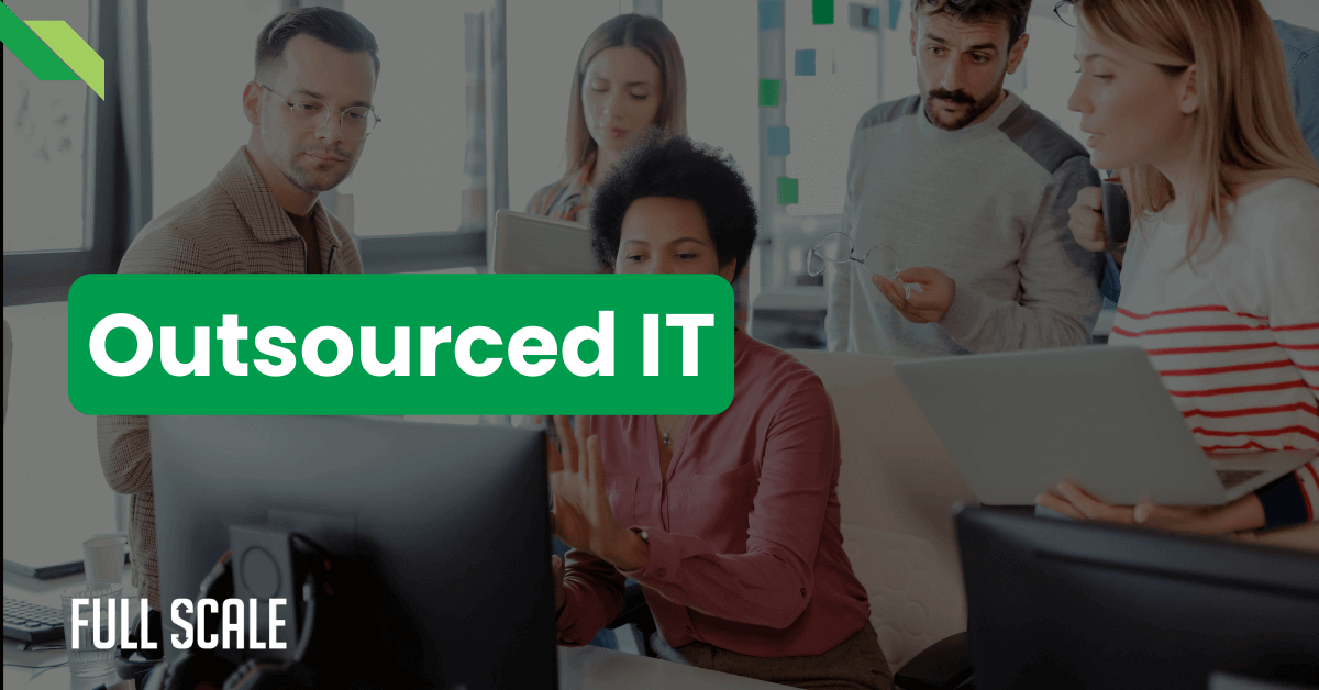 Five people working in an office setting, with the text "Outsourced IT" prominently displayed in the foreground.