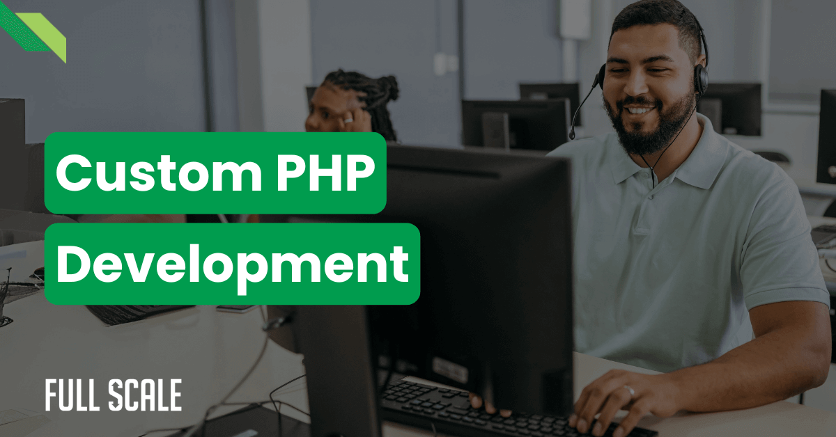 Two people working at computer stations wearing headsets. Text reads "Custom PHP Development." The background shows a modern office environment with a focus on one individual.