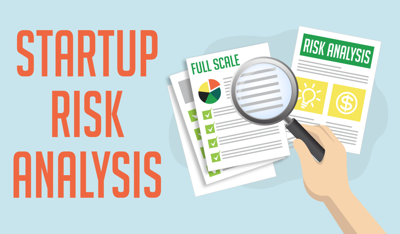 A hand holding a magnifying glass with the words startups risk analysis.