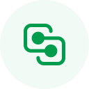 A round green icon with a white outline of a desktop computer and a connected smartphone, representing the seamless integration achieved by dedicated software developers.