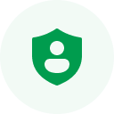 A green circle with a shield icon in the center, featuring a white silhouette of a person's upper body—a symbol that represents our commitment to ui ux design services.