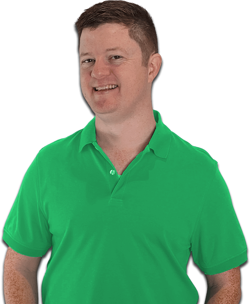 A man in a green polo shirt smiling against a multi-colored striped background.
